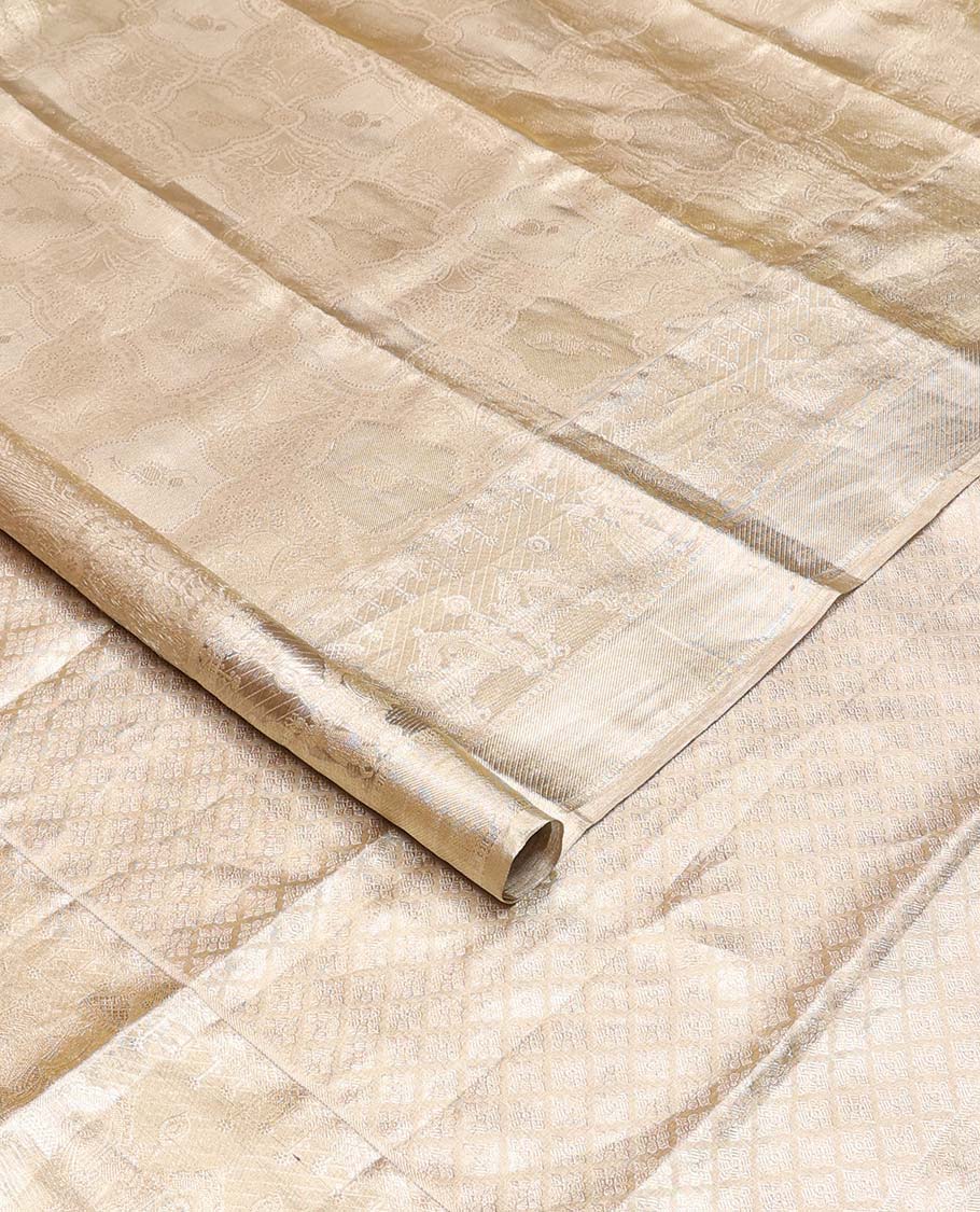 Gold jacquard Kanchipuram silk saree, wedding-theme border, and jaal pallu