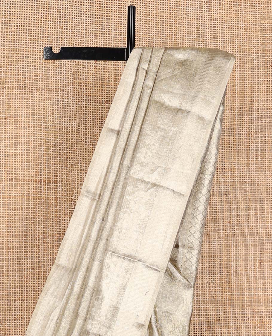 Gold jacquard Kanchipuram silk saree, wedding-theme border, and jaal pallu