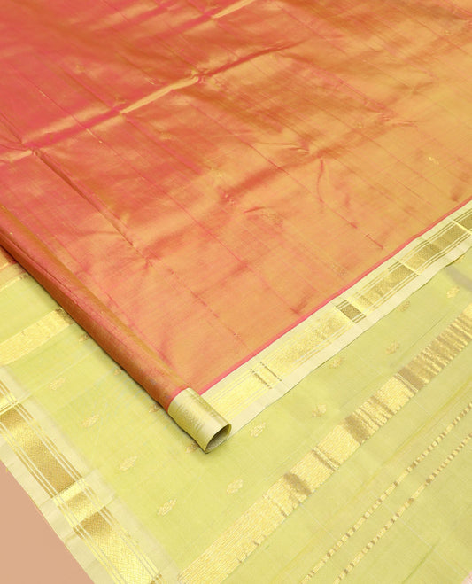 Orange Kanchipuram Silk Saree, Detailed with Zari Buttas All Over Its Body, Complemented by a Contrast One-Sided Border of Banaras, and Jaal Designs, Pallu of Zari Designs, and Comes Without a Blouse