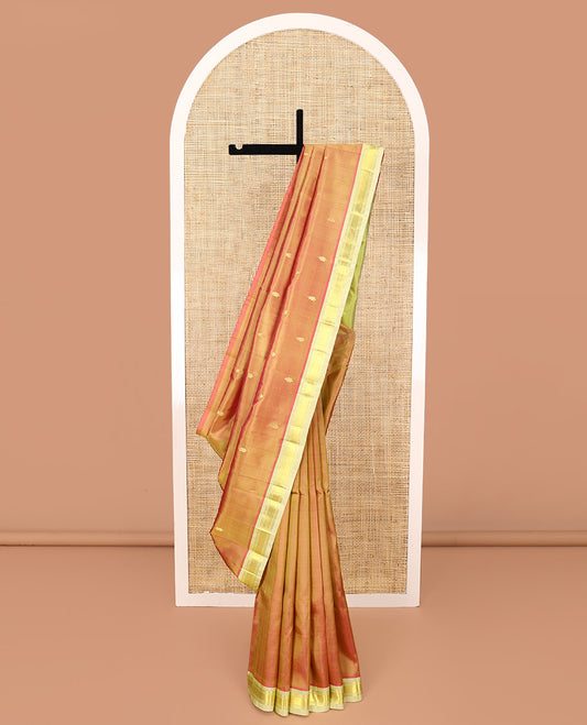 Orange Kanchipuram Silk Saree, Detailed with Zari Buttas All Over Its Body, Complemented by a Contrast One-Sided Border of Banaras, and Jaal Designs, Pallu of Zari Designs, and Comes Without a Blouse