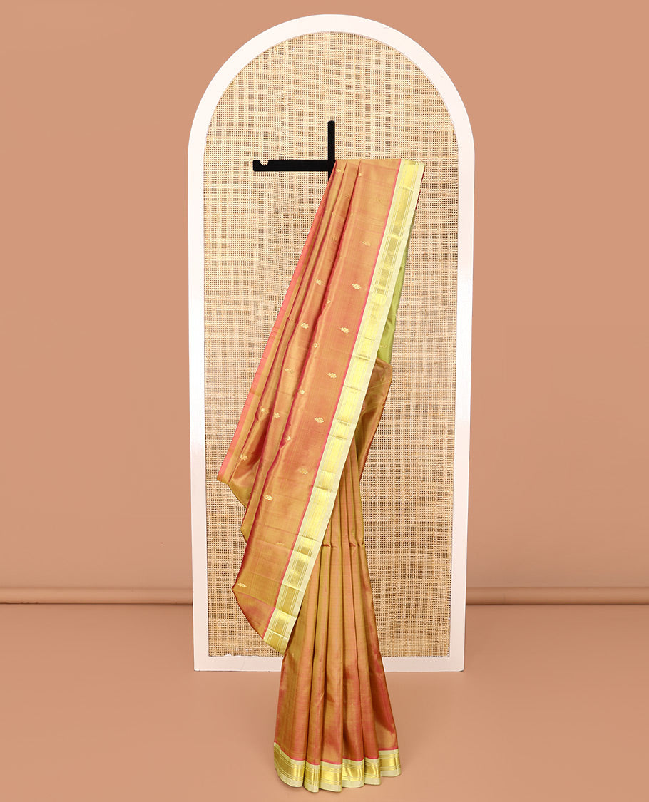Orange Kanchipuram Silk Saree, Detailed with Zari Buttas All Over Its Body, Complemented by a Contrast One-Sided Border of Banaras, and Jaal Designs, Pallu of Zari Designs, and Comes Without a Blouse