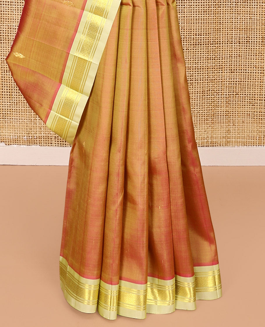 Orange Kanchipuram Silk Saree, Detailed with Zari Buttas All Over Its Body, Complemented by a Contrast One-Sided Border of Banaras, and Jaal Designs, Pallu of Zari Designs, and Comes Without a Blouse