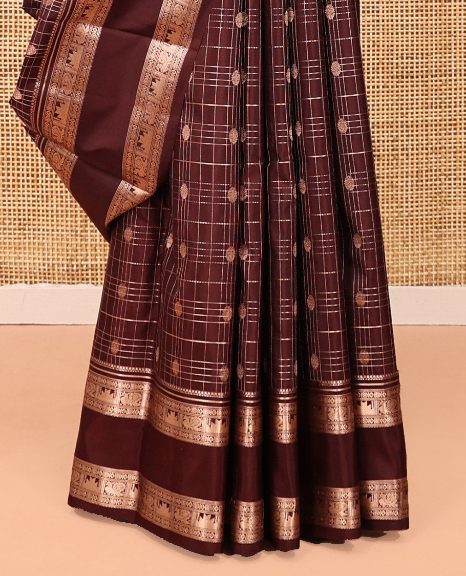 Maroon Kanchipuram Silk Saree, Detailed with Buttas and Checks, a Zari Rettai Pettu Border of Thazampoo Rekku, and Mayil Designs, Grand Pallu, and a Matching Blouse