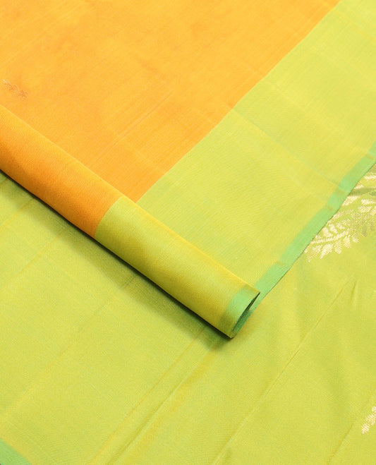 Orange butta kancheepuram silk saree with contrast leaf design border & floral design pallu