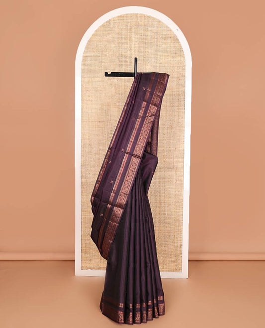 Eggplant purple zari buttas soft silk saree, rettai pettu border of thilakam mokku, neli, and kodi visiry designs, and geometric patterned pallu