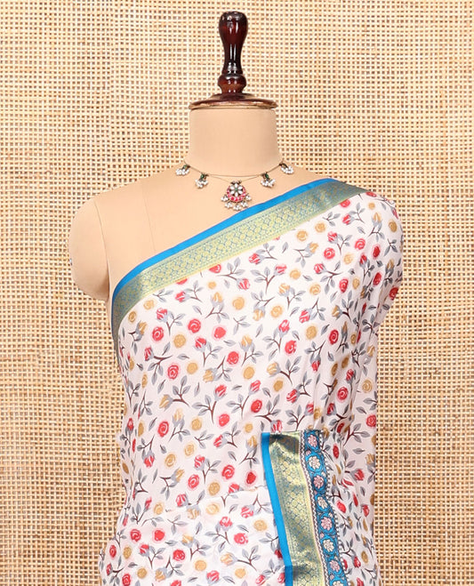 Cream Printed Silk Saree Adorned with a Floral Print, Contrast Traditional Zari Border, Striped Pallu, and Contrast Blouse