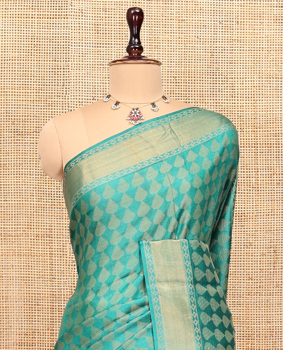 Green Tussar Silk Saree, Adorned with Buttas, a Subtle Border, Pallu of Stripes and Buttas, and a Matching Blouse