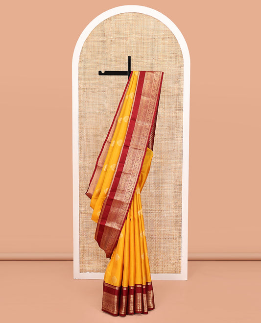 Yellow Vasundhara Lite Silk Mix Saree, Subtly Woven with Iruthalai Pakshi Buttas All Over Its Body, Complemented by Contrast Rettai Pettu Border of Rekku, Diamond, Neli, Laddu Kamalam, and Mayil Designs, Grand Jaal Pallu and Paired with a Contrast Blouse