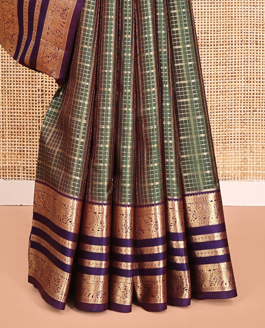 Green Vasundhara Silk Saree, Meticulously Crafted with Zari Butta Enclosed Checks All Over Its Body, Complemented by a Contrast Border of Mayil, Kuthirai, and Yaanai Designs, Grand Jaal Pallu, and Paired with a Contrast Blouse