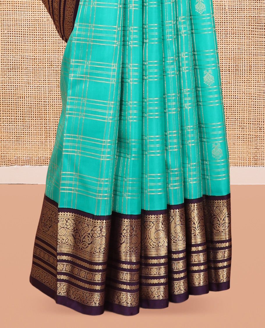 Turquoise Vasundhara Silk Saree, Accentuated with Zari Checks, a Contrast Border of Thilakam Mokku, Mayil, Neli, and Kamalam Designs, a Grand Jaal Pallu, and a Contrast Blouse
