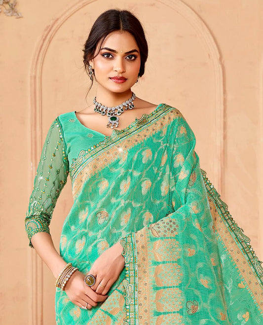 Turquoise jaal and micro-stone work designer saree, paisleys embroidered scallop border, and  pallu of ogee patterns and stone work
