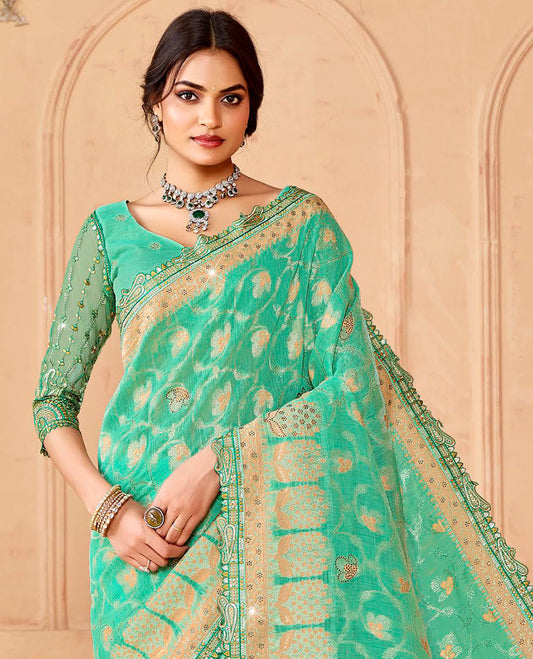 Turquoise floral vine & stone work dola silksaree, paisley patch embroidery border & intricately woven stonework pallu