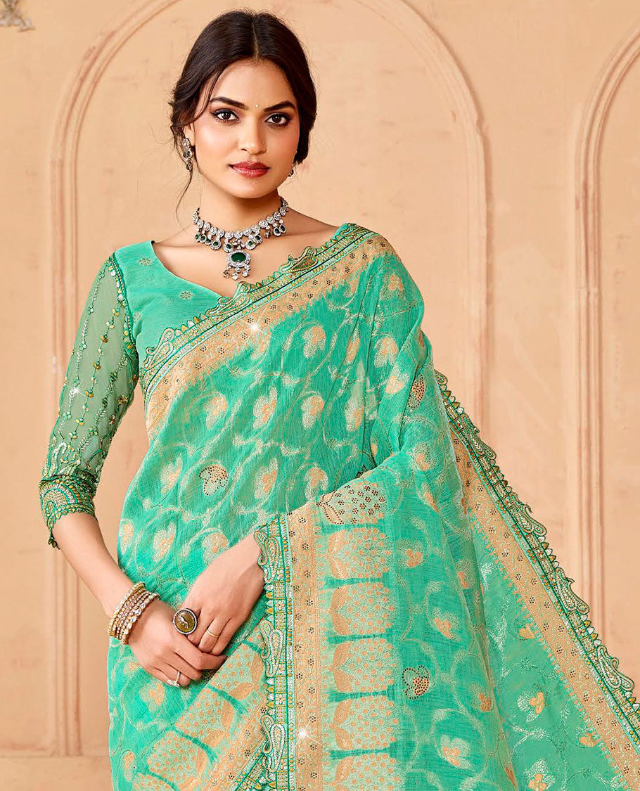 Turquoise floral vine & stone work dola silksaree, paisley patch embroidery border & intricately woven stonework pallu