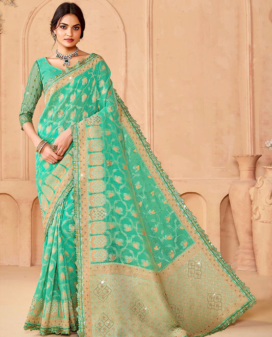 Turquoise floral vine & stone work dola silksaree, paisley patch embroidery border & intricately woven stonework pallu