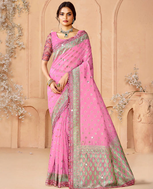 Pink buttas and micro-stone work designer saree, scallop embroidered border, and pallu of leaf patterns and stone work