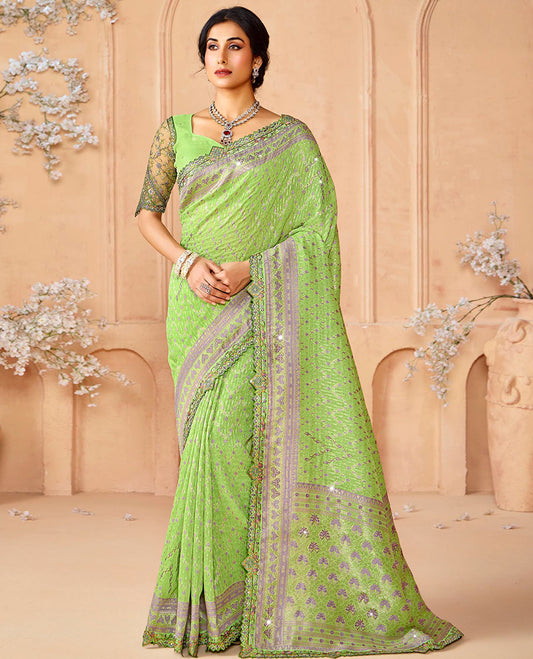 Green buttas and micro-stone work designer saree, scallop embroidered border, and pallu of intricate designs and stone work