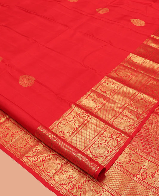 Red Kanchipuram Silk Saree, Spotlighted with Zari Buttas, Highlighted by Zari Border of Rekku, Rudraksham, Paisley Vine and Jaal Designs, Jaal Pallu, and a Matching Blouse