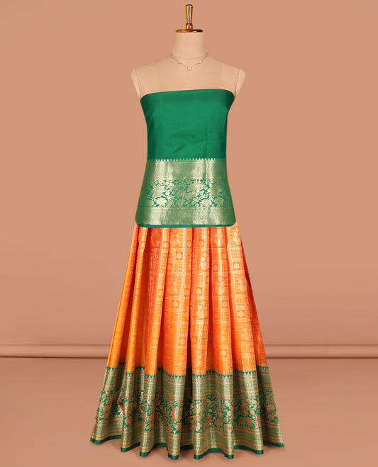 Orange Art Silk Pavadai Material Set, Gracefully Embellished with Jacquard Designs on Its Skirt, Complemented by a Contrast Floral Zari Design, Delicately Woven Border, and Paired with a Contrast Blouse