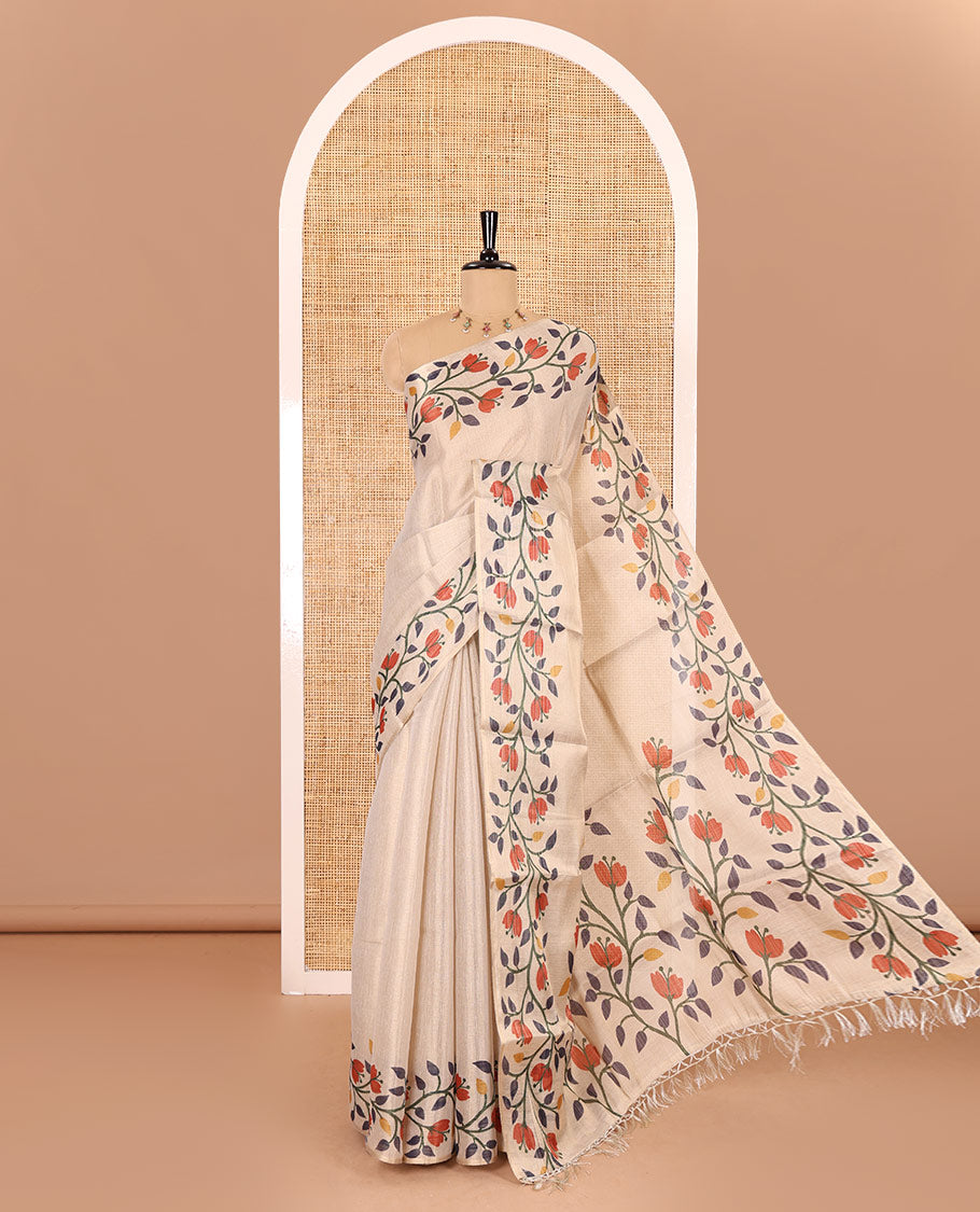 Cream plain tissue saree, printed border and pallu of jamdani floral vine print, and a matching floral buttas printed blouse