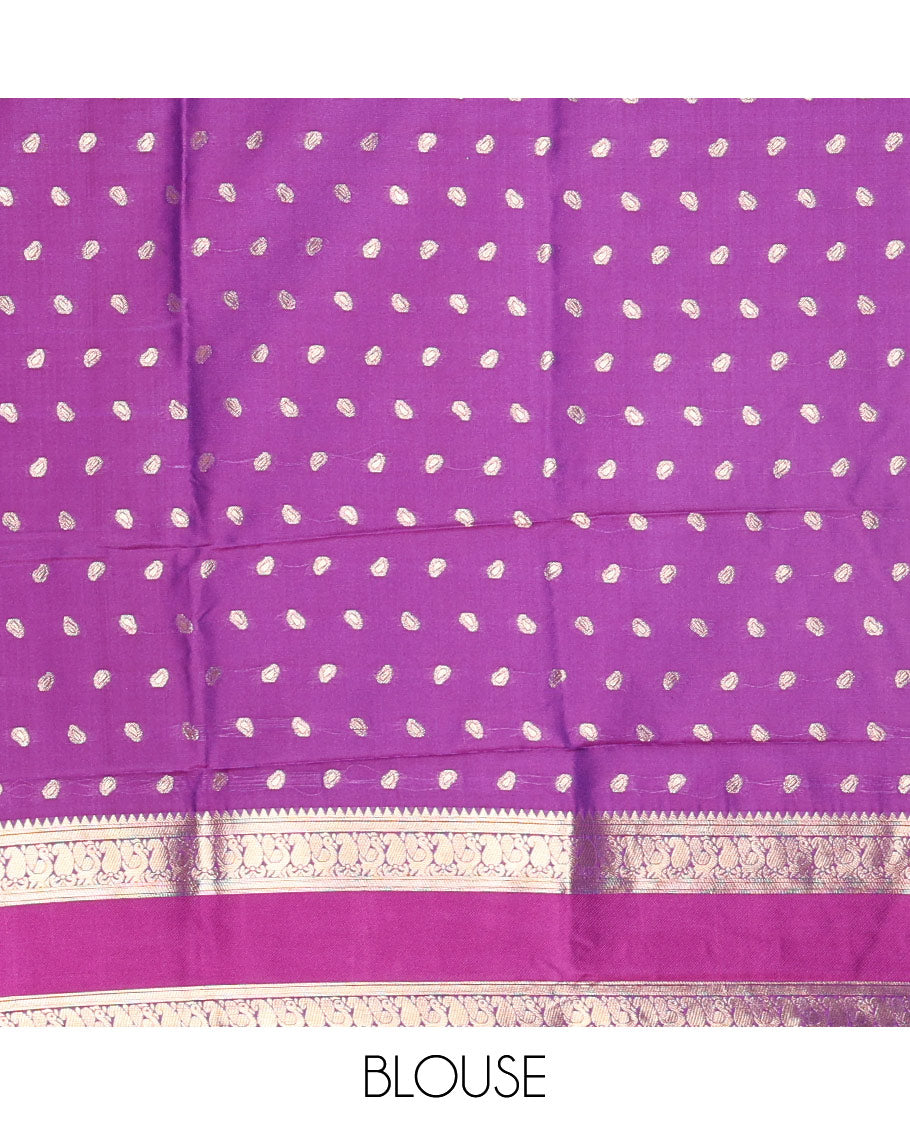 Blue zari buttas kanchi soft silk saree, contrast manga and peacock motifs woven rettai pettu border, ogee patterned pallu, and a zari design blouse