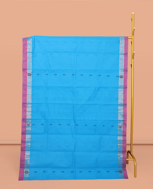 Blue Kanchi Cotton Saree, Enthralled with Buttas All Over Its Body, Complemented by a Contrast Border, Pallu of Paisley and Floral Design, and Paired with a Matching Blouse