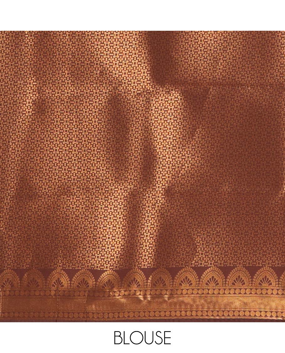 Rust orange-brown floral and bird jacquard kanchi silk saree, contrast temple border, zari-rich jaal pallu, and a jacquard blouse