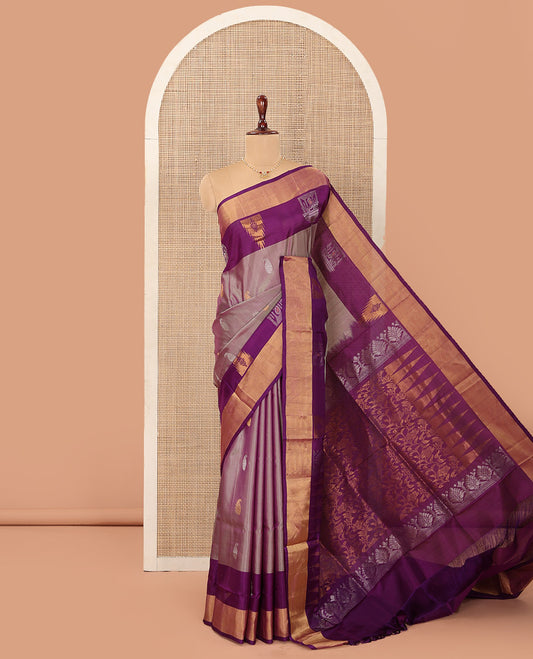 Pink Uppada Silk Saree Spotlighted with Paisley Buttas All Over Its Body, Complemented by Contrast Border of Temple and Chariot Designs, Grandly Woven Pallu of Temple Floral Vine Designs, and Paired with a Contrast Blouse