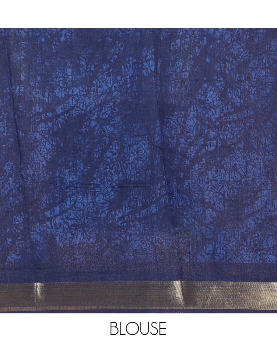 Rama Green Linen Cotton Saree, Adorned with Shibori Printed All Over Its Body, Complemented by a Contrast Batik Printed Zari Border, Floral Printed Pallu, and Paired with a Contrast Blouse