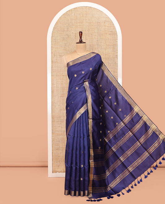 Blue Banana Pith Saree, Subtly Adorned with Buttas All Over Its Body, Highlighted by a Zari Bavanji Border, Gleaming Zari Striped Pallu, and Paired with a Matching Blouse