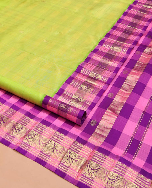 Green Kanchipuram Silk Saree, Embellished with Zari Buttas on Its Body, Complemented by a Contrast One-Sided Korvai Checked Border of Zari Designs, Pallu Features Zari Designs, and Comes Without a Blouse