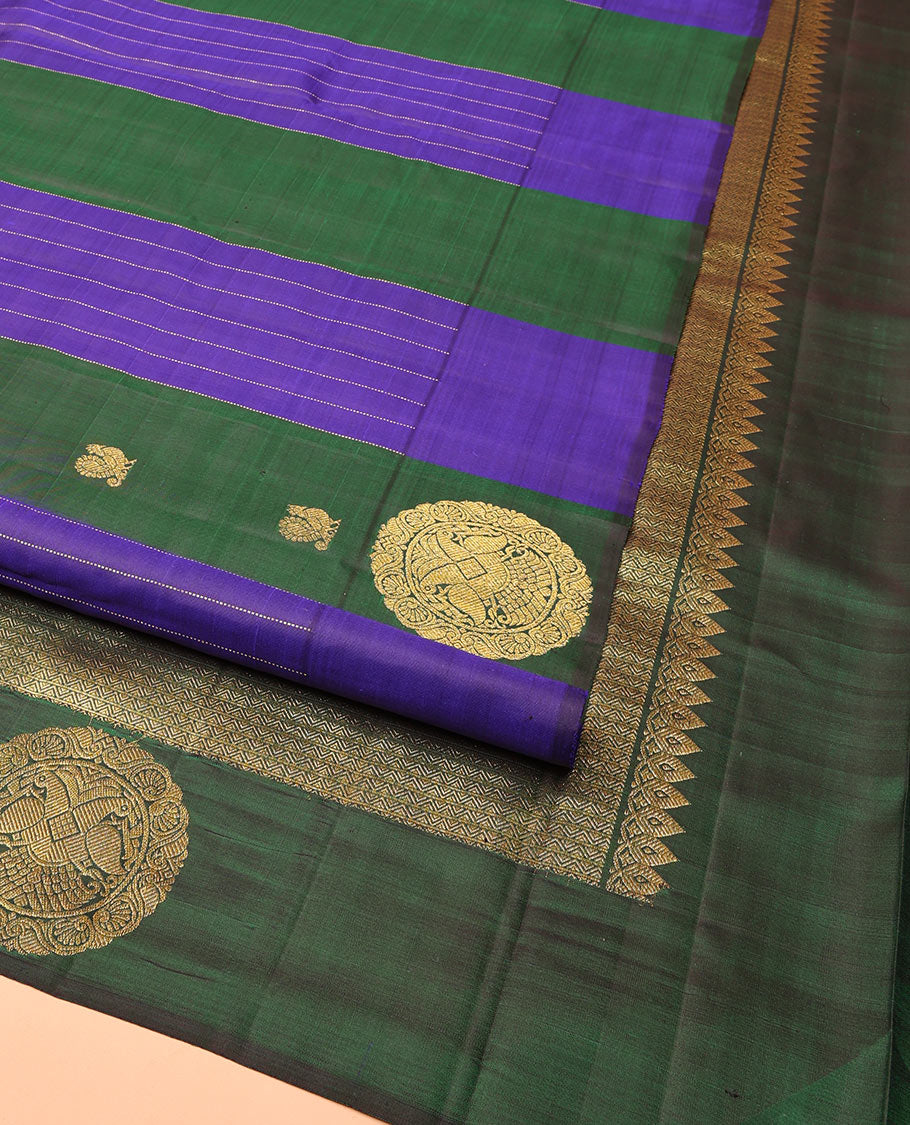 Blue and Green Striped Kanchipuram Silk Saree, Beautifully Bedecked with Muthu Stripes, Mayil, and Round Iruthaipakshi Motifs All Over Its Body,  Grand Pallu of Triangle Motifs, and Paired with a Contrast Blouse