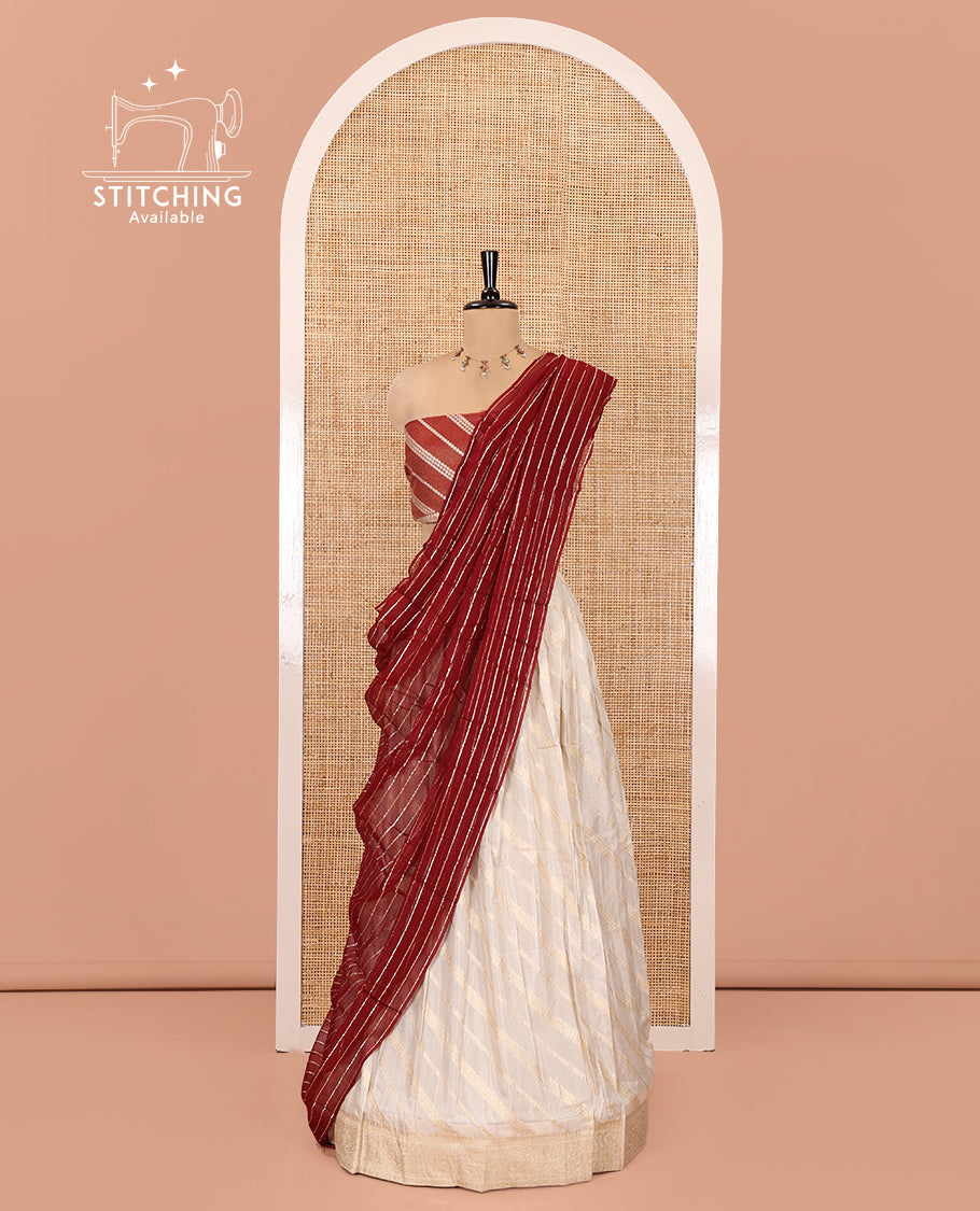Cream-Maroon Semi-Banarasi Half-Saree Features Leheriya Striped Skirt, Contrast Leheriya Striped Blouse, Georgette Striped Dhavani