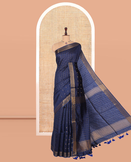Blue Banana Pith Saree, Gleamed Up with Checks and Buttas, a Zari Temple Border, Striped Pallu, and Matching Blouse