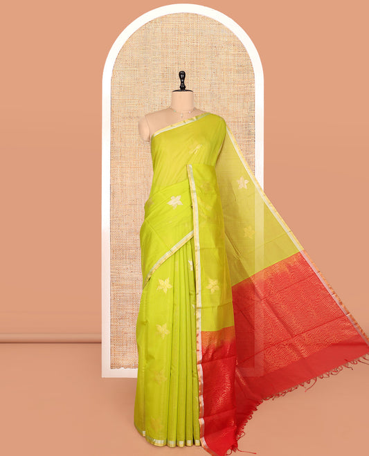 Leaf Green Silk Cotton Saree, Gleamed Up with Floral Buttas, a Subtle Piping Border, Contrast Pallu of Intricate Designs, and a Contrast Blouse