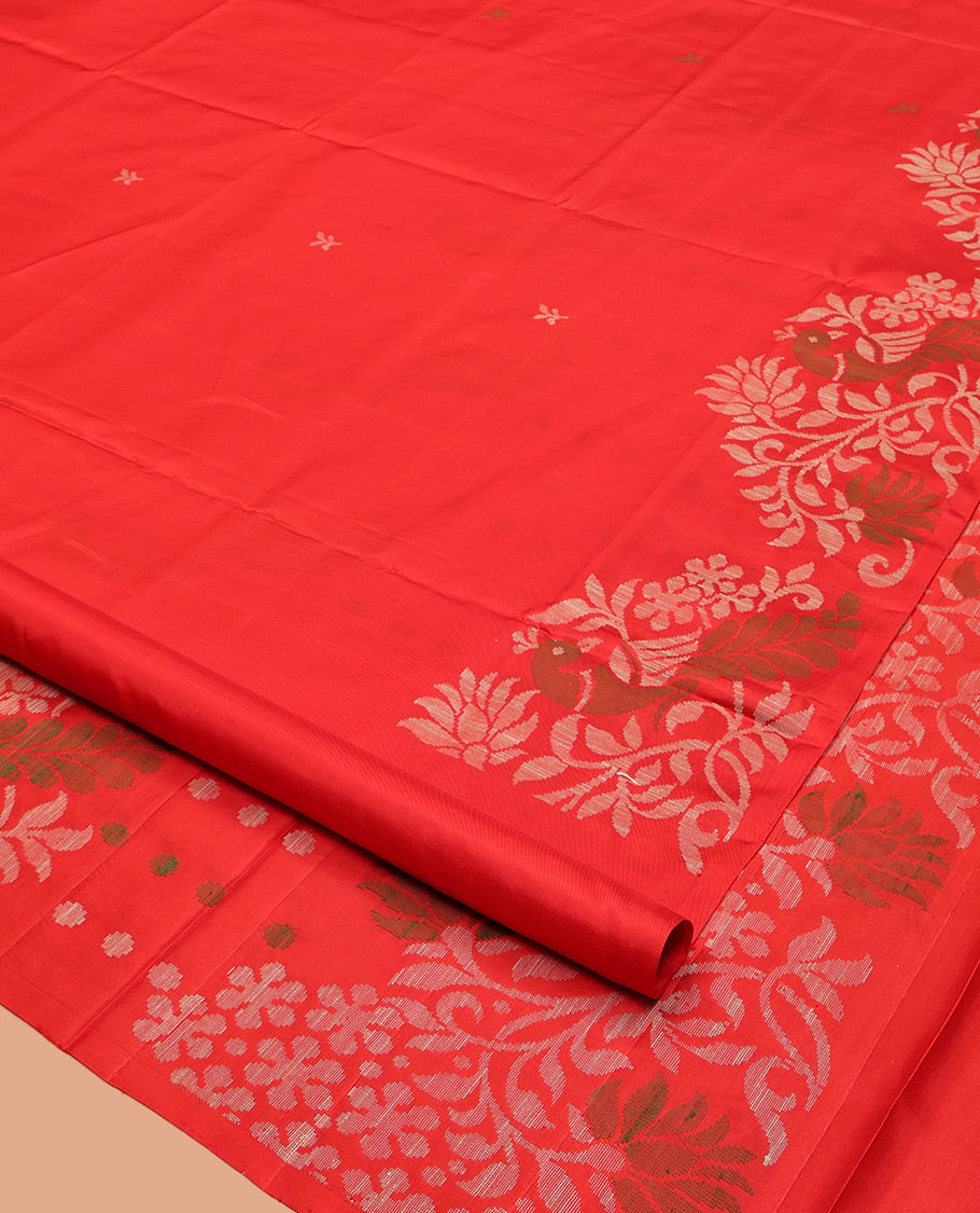 Red Mayuri Soft Silk Saree, Subtly Sparkled with Buttas, Highlighted by a Self-Border of Floral and Peacock Design, Pallu Mirrors the Same Design, and a Matching Blouse