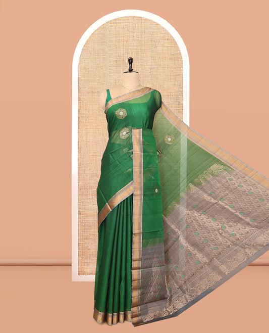 Green Cotton Saree, Highlighted by Zari Buttas, a Contrast Zari Border, an Intricate Pallu and a Contrast Blouse