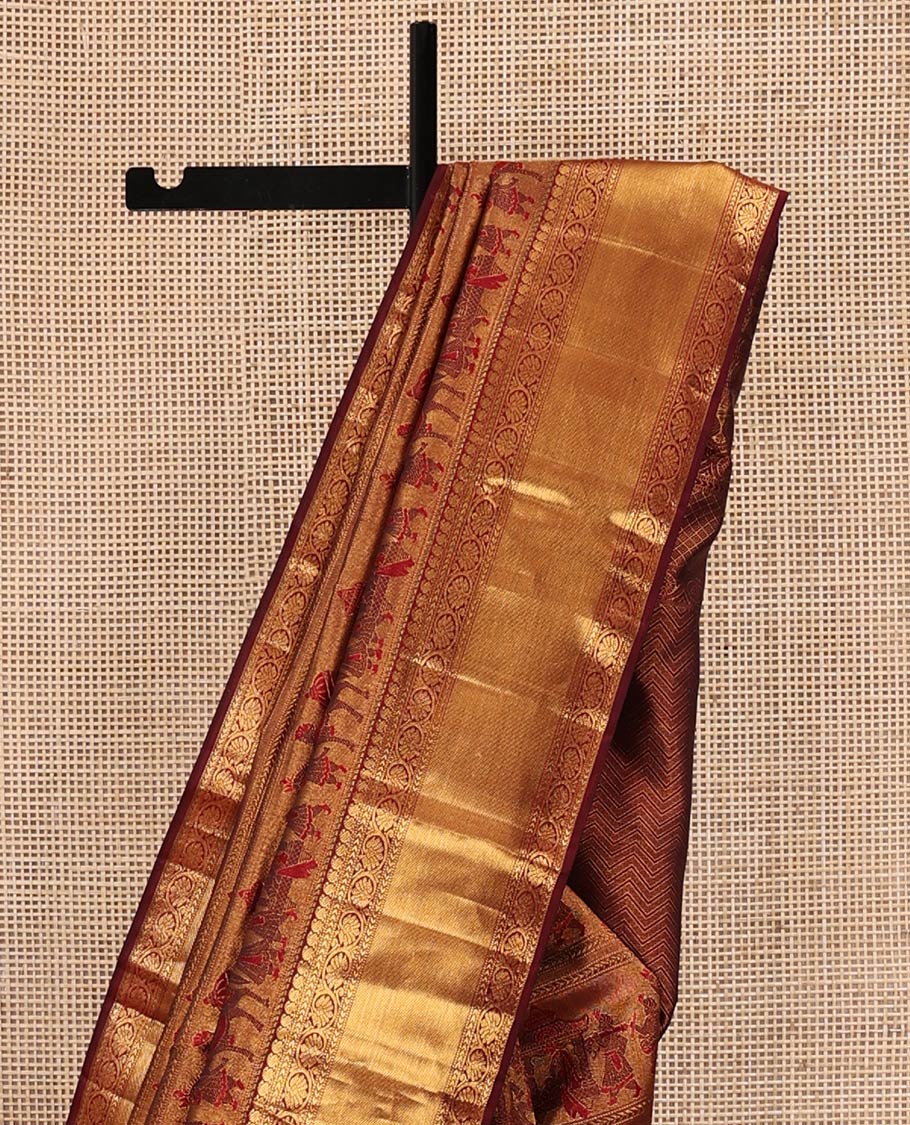 Maroon Kanchipuram Wedding Silk Saree, Gracefully Embellished with King and Queen Wedding Theme Jacquard Weave, Highlighted by Zari Border of Manga Mokku, and Kodi Visiry Designs, Chevron Striped Pallu and Paired with a Matching Blouse