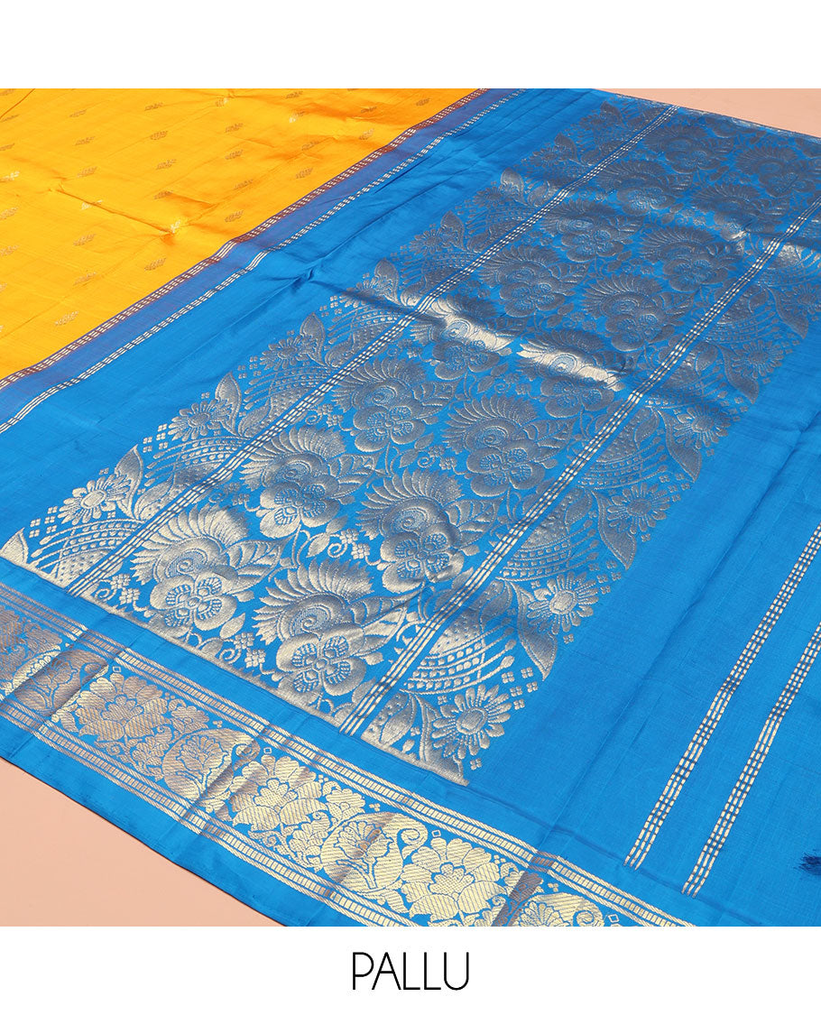 Yellow Kanchipuram Silk Saree, Ornamented with Zari Buttas on Its Body, Complemented by a Contrast One-Sided Korvai Border of Banaras, Muthu, Floral and Paisley Designs, Pallu of Intricate Designs, and Comes Without a Blouse