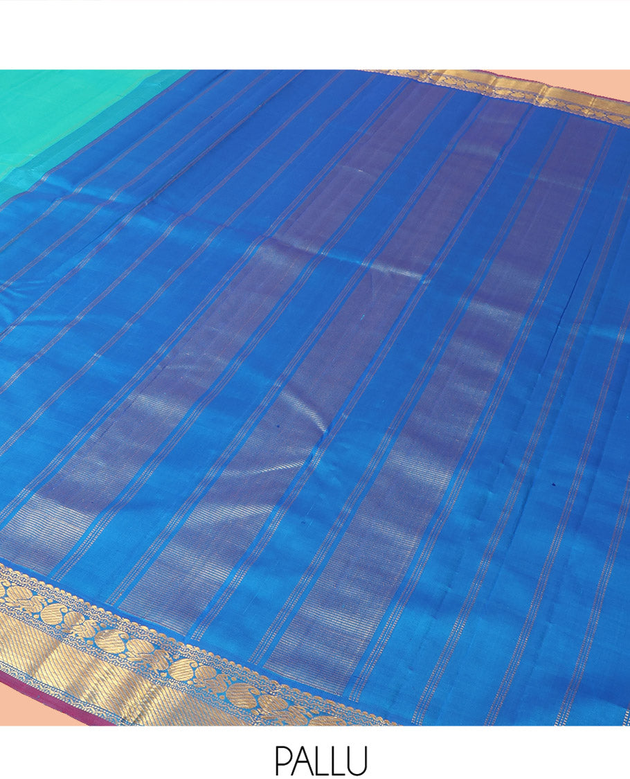 Blue Plain Kanchipuram Silk Saree, Complemented by Contrast Border of Salngai, Muthu, Rekku, Manga, Mayil, and Zari Stripes, Subtly Sparkled Pallu, and Paired with a Contrast Blouse