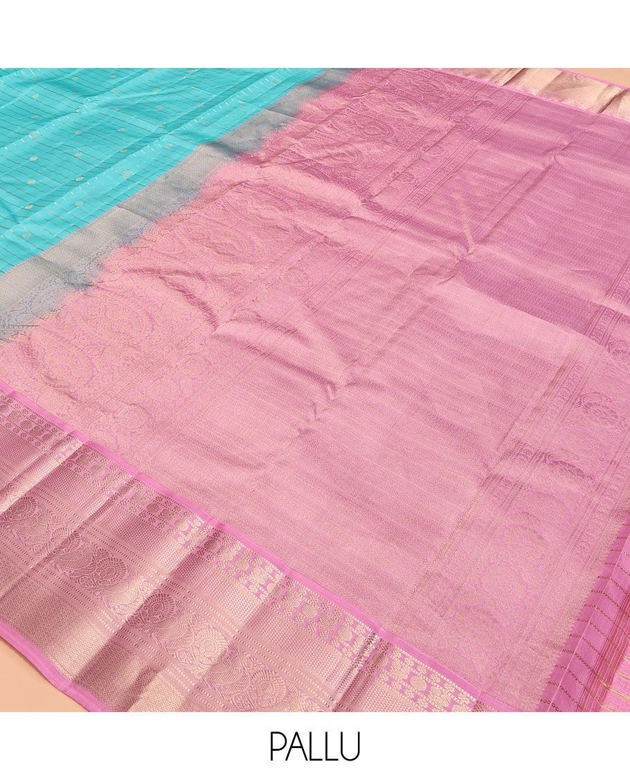 Blue Vasundhara Silk Saree, Sparsely Sparkled with Zari Stripes and Buttas, Contrast Border of Muthu, Kamalam, Mayil, Poun, Ara Maadam, and Mayil Designs, Grand Pallu, and a Contrast Blouse