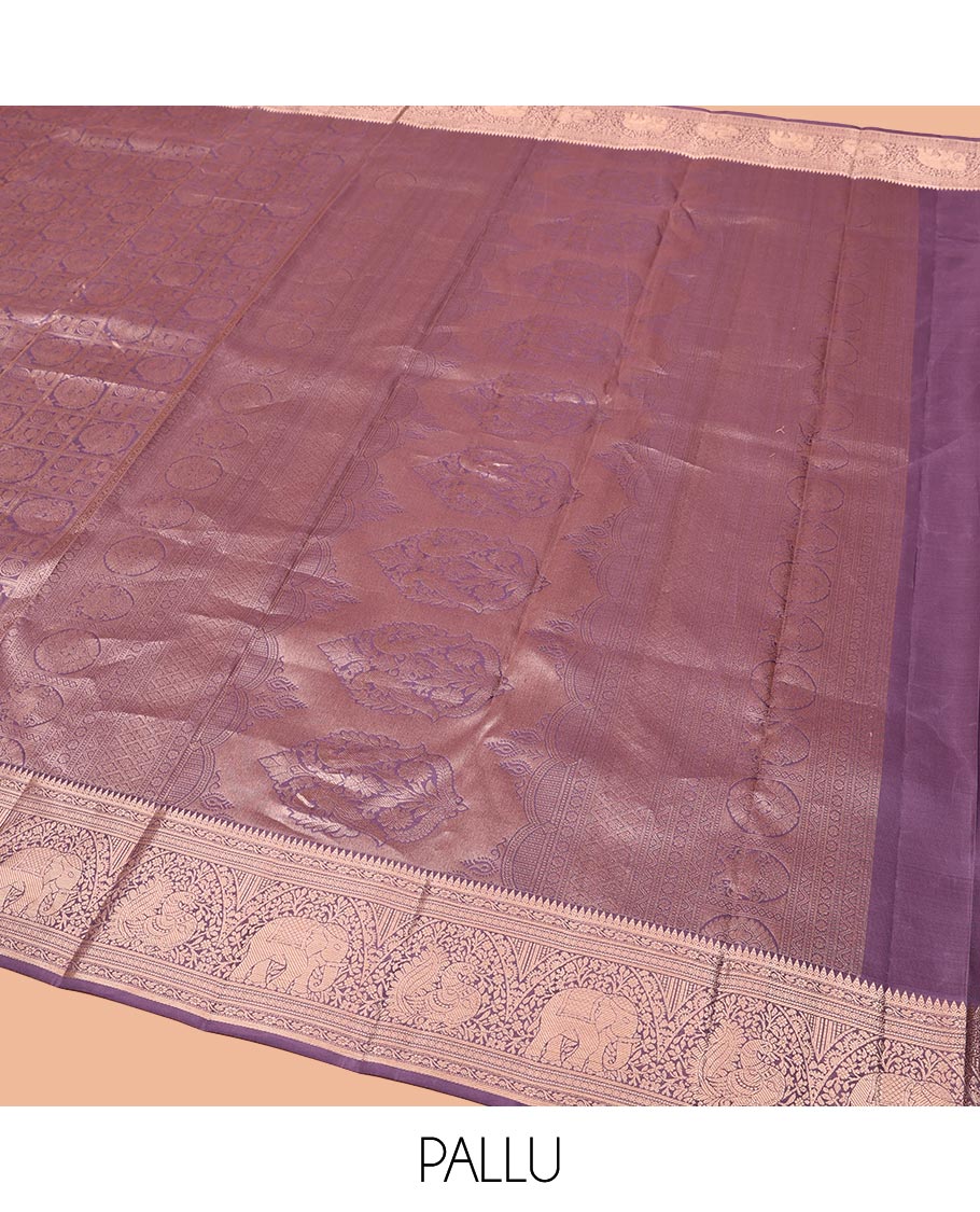 Purple Kanchipuram Wedding Silk Saree, Beautifully Bedecked with Mayil-Chakram Jacquard on Its Body, Highlighted by a Zari Border of Thilakam Mokku, Kodi Visiry, Annam, and Yaanai Designs, Intricately Designed Pallu, and Paired with a Matching Blouse