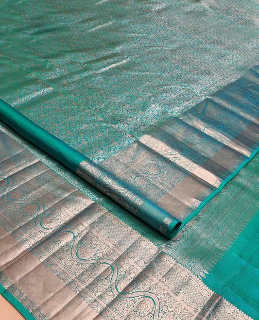 Blue Kanchipuram Wedding Silk Saree, Enriched with Jacquard Design on Its Body, Highlighted by Zari Border of Thilakam Mokku, Mayil Kann, Kathir, and Dhavana Kodi Designs, Grand Pallu, and Paired with a Matching Blouse