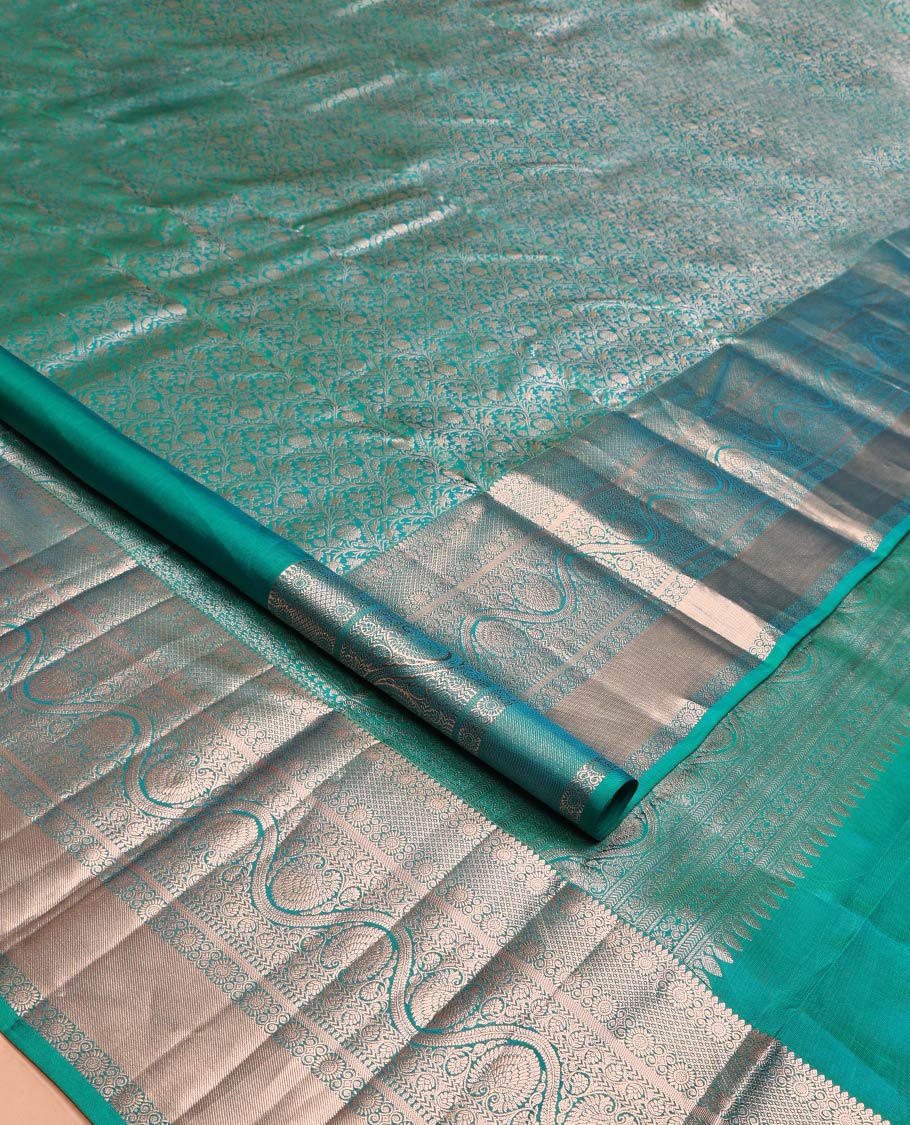 Blue Kanchipuram Wedding Silk Saree, Enriched with Jacquard Design on Its Body, Highlighted by Zari Border of Thilakam Mokku, Mayil Kann, Kathir, and Dhavana Kodi Designs, Grand Pallu, and Paired with a Matching Blouse