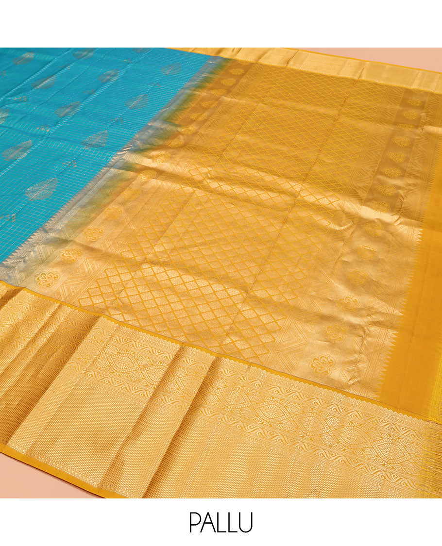 Blue Vasundhara Silk Saree, Masterfully Woven with Zari Buttas and Zari Checks All Over Its Body, Complemented by a Contrast Border of Traditional Designs, Grandly Woven Jaal Pallu, and Paired with a Contrast Blouse