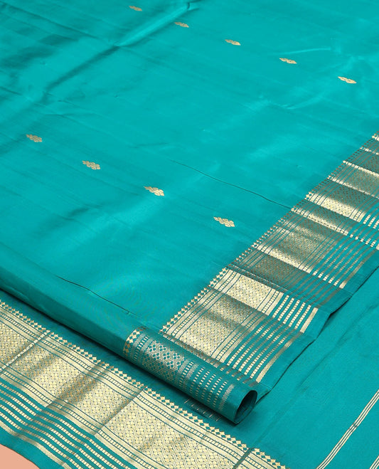 Blue Kanchipuram Silk Saree, Woven with Zari Buttas, a One-Sided Border of Panner Sombu, Banaras, Muthu, and Jaal Designs, a Zari Design Pallu, and No Blouse
