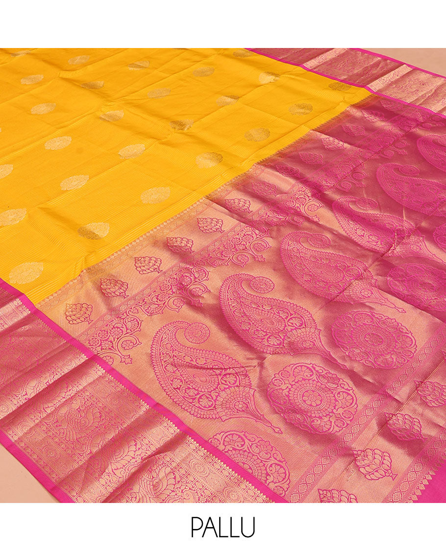 Yellow Vasundhara Silk Saree, Detailed with Zari Buttas and Stripes All Over Its Body, Complemented by a Contrast Border of Rekku, Muthu, Poun, Chakram, and Mayil Designs, Grand Manga Design Pallu, and Paired with a Contrast Blouse