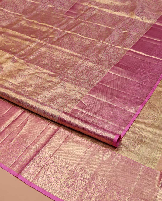 Pink Kanchipuram Tissue Silk Saree, Gracefully Embellished with Floral Jaal Jacquard Design On Its Body, Complemented by Zari Border of Thilakam Mokku, Muthu, and Mayil Kann Designs, Grandly Decked Up Pallu and Paired with a Matching Blouse