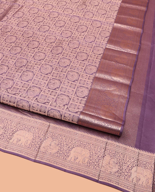 Purple Kanchipuram Wedding Silk Saree, Beautifully Bedecked with Mayil-Chakram Jacquard on Its Body, Highlighted by a Zari Border of Thilakam Mokku, Kodi Visiry, Annam, and Yaanai Designs, Intricately Designed Pallu, and Paired with a Matching Blouse