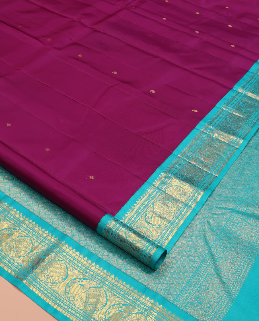 Purple Vasundhara Silk Saree, Subtly Sparkled With Zari Buttas All Over Its Body, Complemented by Zari Buttas All Over Its Body, Complemented by Contrast Border of Thilakam, Banaras, and Mayil Designs Grand Jaal Pallu and Paired with a Contrast Blouse