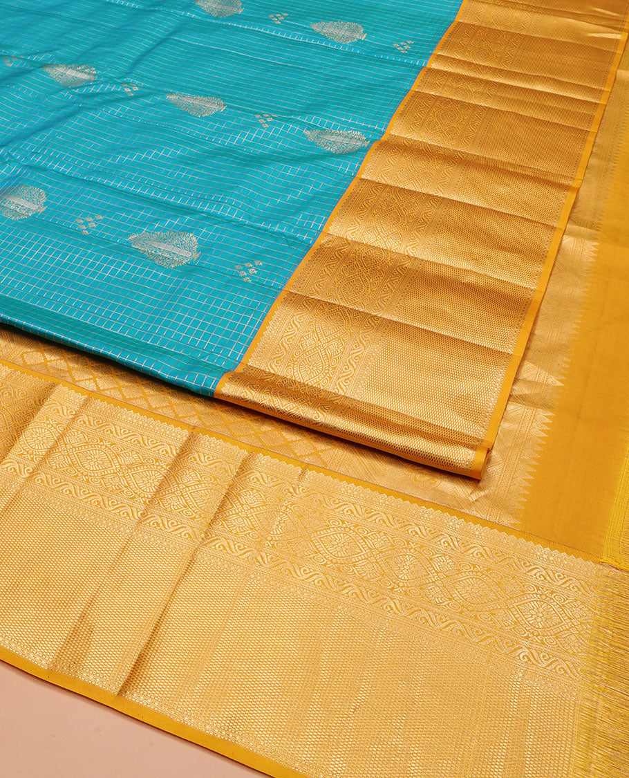Blue Vasundhara Silk Saree, Masterfully Woven with Zari Buttas and Zari Checks All Over Its Body, Complemented by a Contrast Border of Traditional Designs, Grandly Woven Jaal Pallu, and Paired with a Contrast Blouse